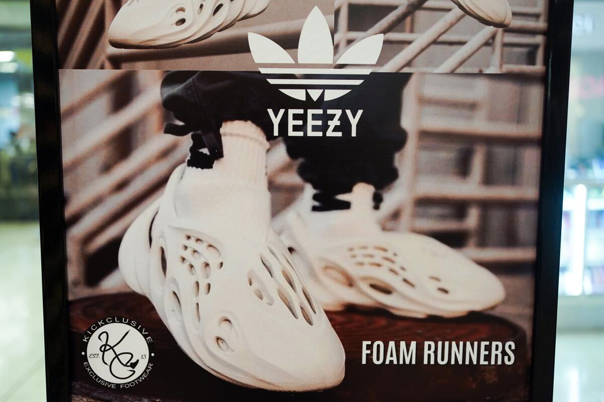 A sign advertises Yeezy shoes made by Adidas 
