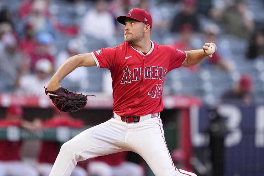 Los Angeles Angels starting pitcher Reid Detmers throws to the plate during the first inning.