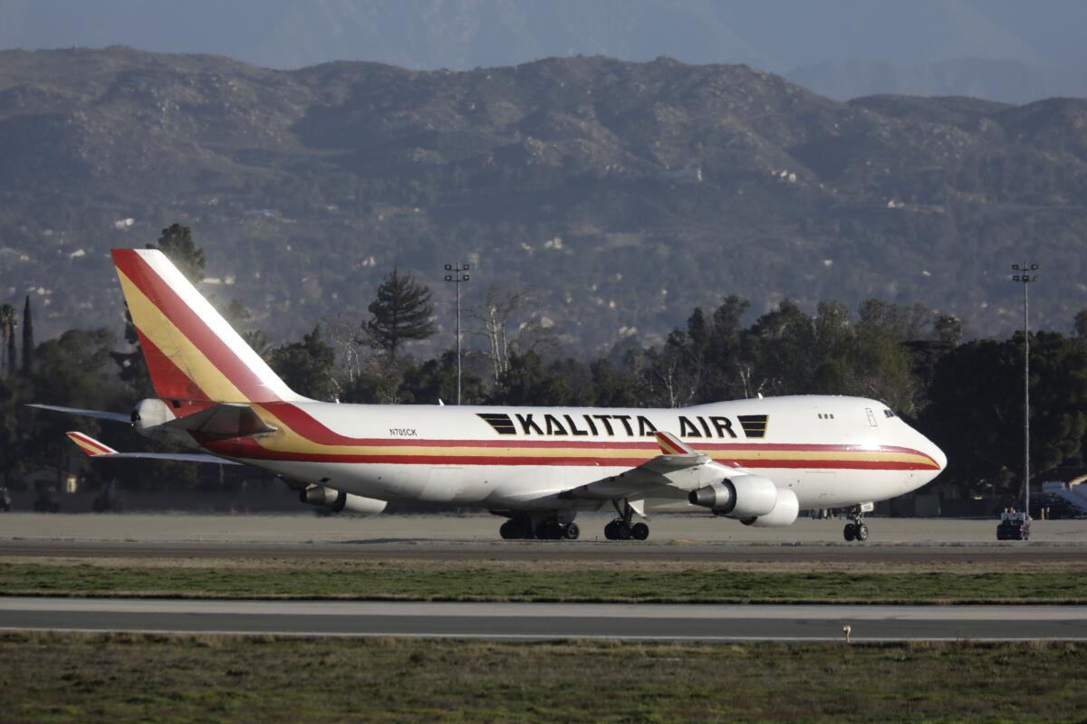A Boeing 747 on a charter flight from Wuhan, China, arrives Wednesday at March Air Reserve Base in Riverside County.