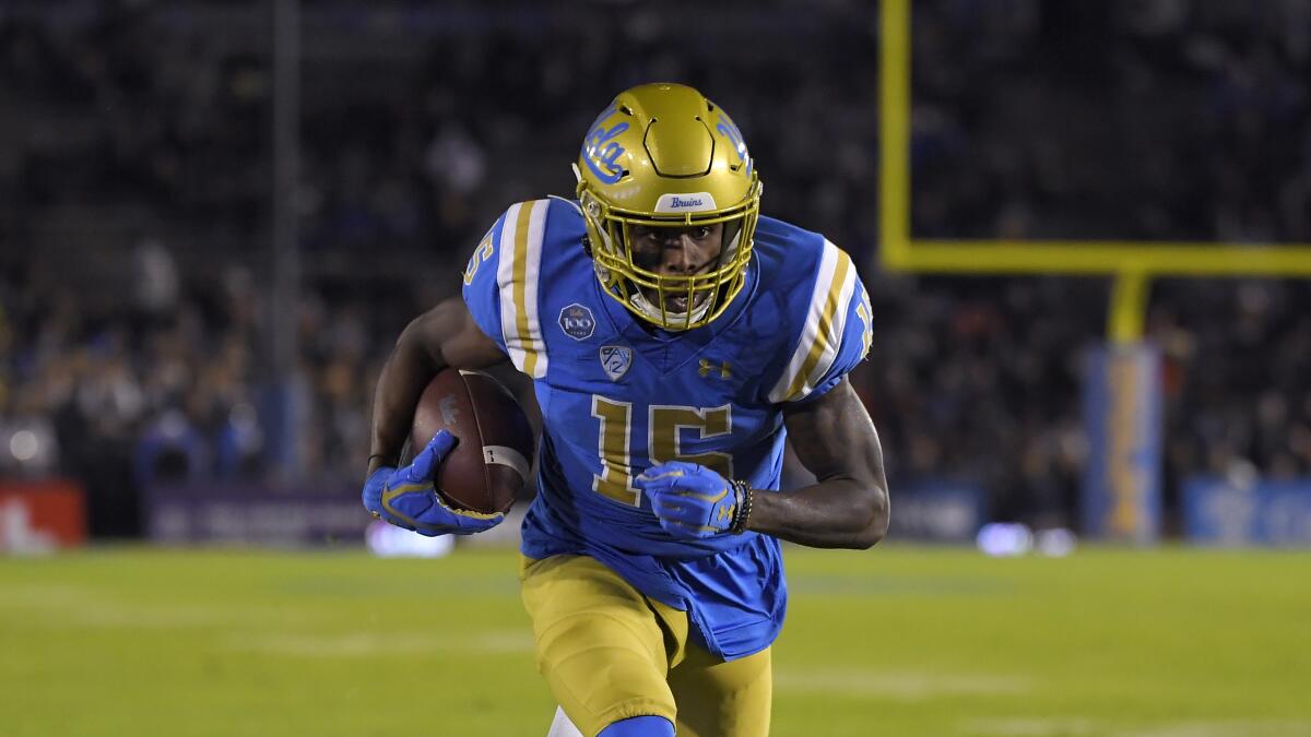 UCLA wide receiver Jaylen Erwin heads toward the end zone for a score against California.