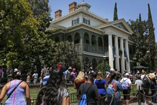 ANAHEIM, CALIF. -- FRIDAY, JUNE 30, 2017: Guests wait in line at the Haunted Mansion at Disneyland in Anaheim, Calif., on June 30, 2017. (Gary Coronado / Los Angeles Times)