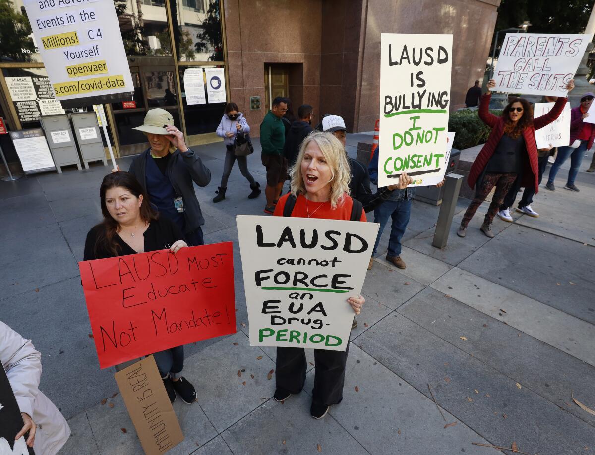 People protest the Los Angeles Unified School District's vaccine mandate in downtown L.A. on Dec. 8.