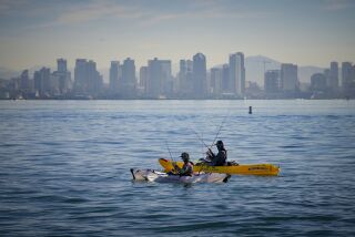 San Diego, CA - November 23: On Wednesday, Nov. 23, 2022 in San Diego, CA., two kayak fisherman took advantage of the fair weather to enjoy the late morning kayak fishing. (Nelvin C. Cepeda / The San Diego Union-Tribune)