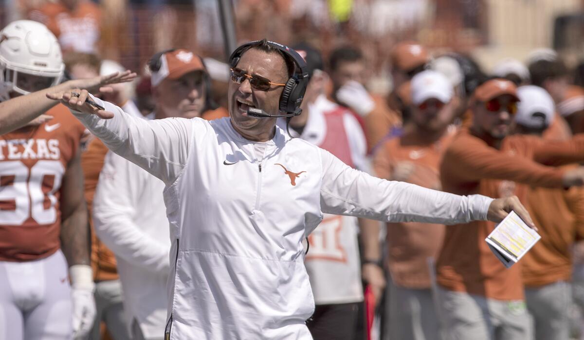 Texas head coach Steve Sarkisian tries to quiet the fans before an offensive play against Alabama during the first half of an NCAA college football game, Saturday, Sept. 10, 2022, in Austin, Texas. (AP Photo/Rodolfo Gonzalez)
