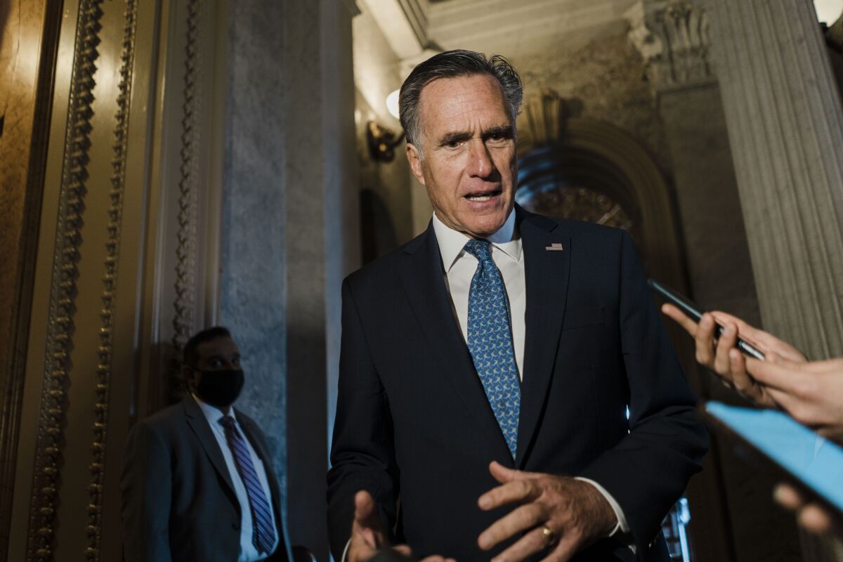 Sen. Mitt Romney in a hallway
