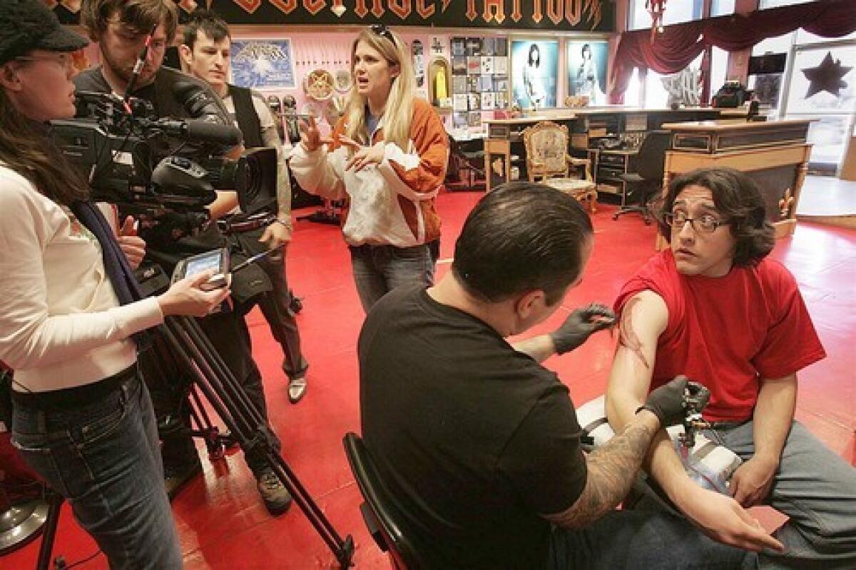 Joshua Sandoval gets inked by Corey Miller at High Voltage Tattoo during taping for the show "LA Ink." Sandoval envisioned a tattoo that would speak to his place in the world.