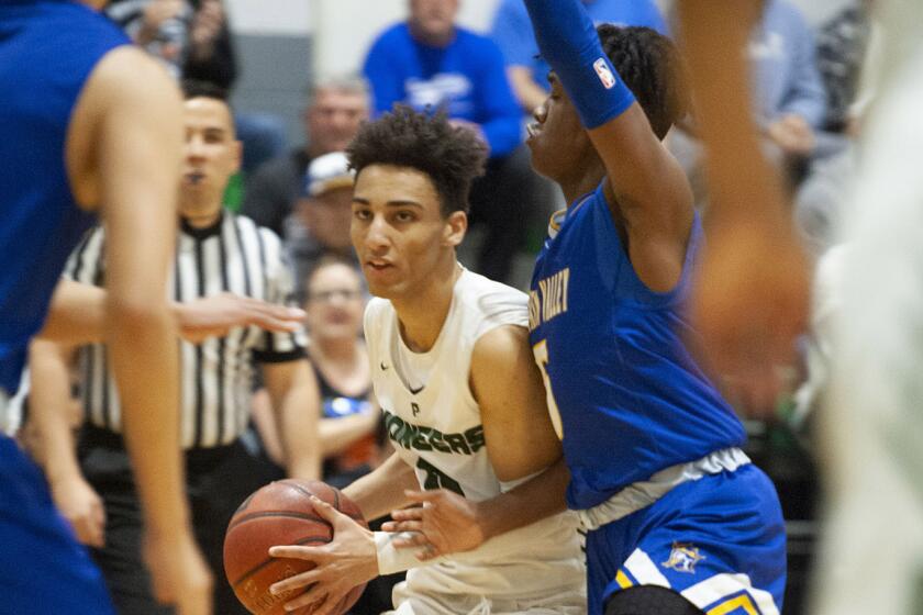 Providence's Jordan Shelley moves the ball past Fountain Valley's Jermiah Davis during CIF State Division III Southern California Regional semifinal at Providence High. (Photo by Miguel Vasconcellos)
