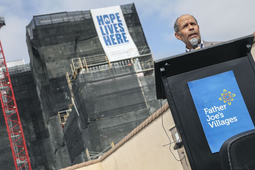 Father Joe's President Deacon Jim Vargas speaks to members of the media during the unveiling of a banner reading "Hope Lives Here"on the new 14-story, 407-room St. Teresa of Calcutta project that is under construction on Monday in Downtown San Diego, April 12, 2021.(Photo by Sandy Huffaker for The San Diego Union-Tribune)