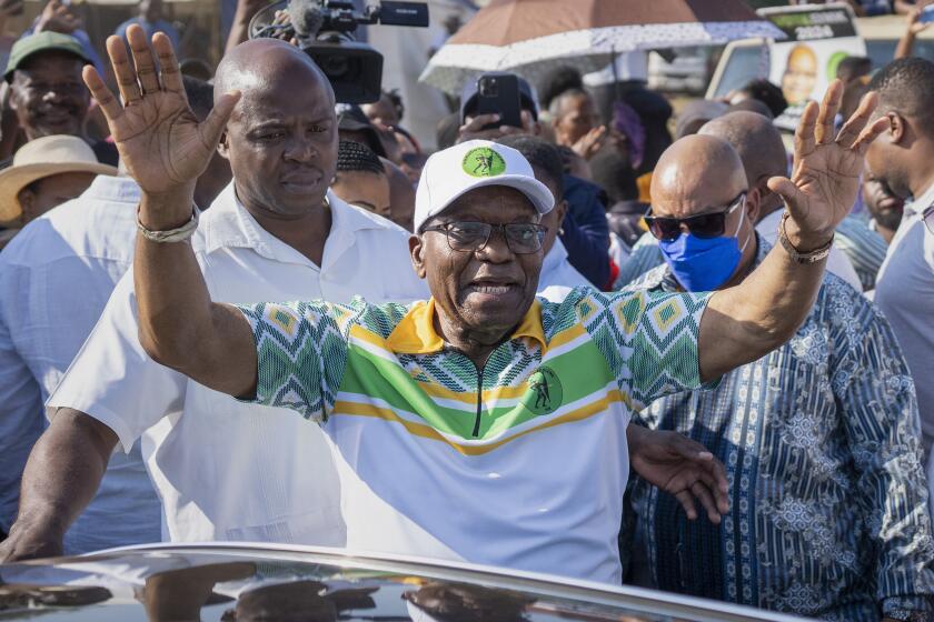 FILE - Former president of the A.N.C. and South Africa, Jacob Zuma, waves to supporters after casting his ballot in Nkandla, Kwazulu Natal, South Africa, Wednesday, May 29, 2024 during the general elections. The African National Congress (ANC) announced Monday, July 29, 2024 that Zuma has been expelled from the ANC. (AP Photo/Emilio Morenatti, File)