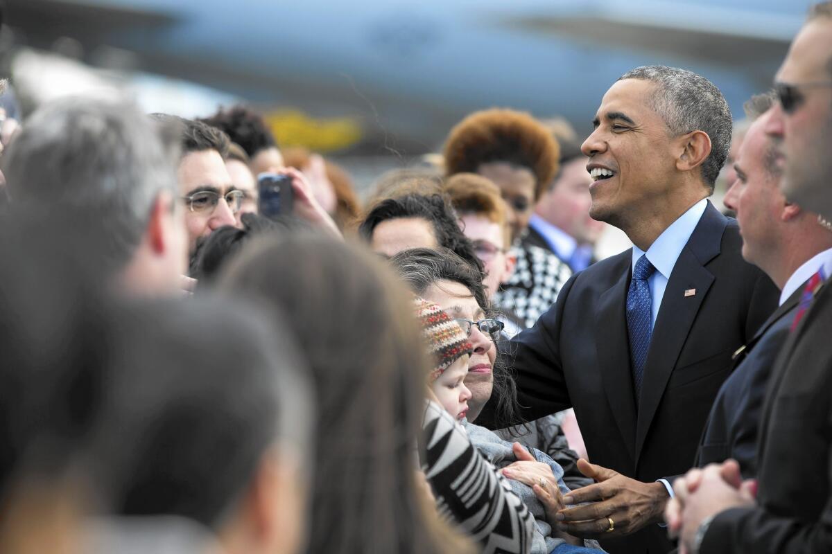 President Obama arrives at Mitchell International Airport in Milwaukee on Tuesday. He later attended a campaign rally for gubernatorial candidate Mary Burke.