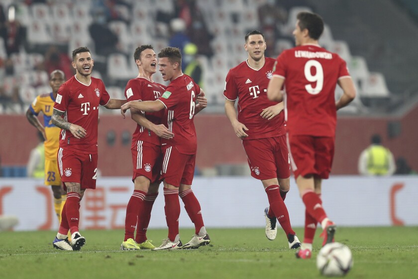 Bayern's Benjamin Pavard, second left, celebrates after scoring his side's opening goal during the Club World Cup final soccer match between FC Bayern Munich and Tigres at the Education City stadium in Al Rayyan, Qatar, Thursday, Feb. 11, 2021. (AP Photo)