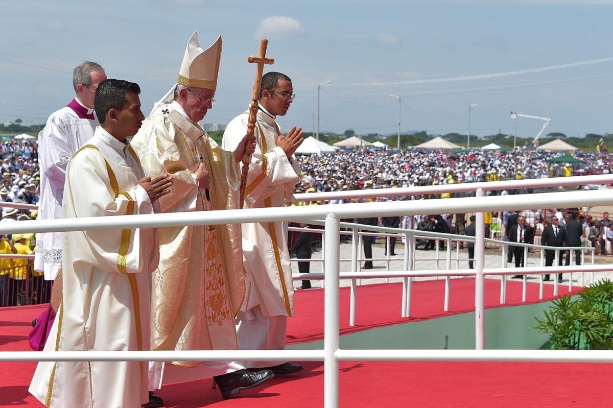 Pope Francis arrives to celebrate an open-air Mass at Parque Samanes in Guayaquil, Ecuador, on Monday.
