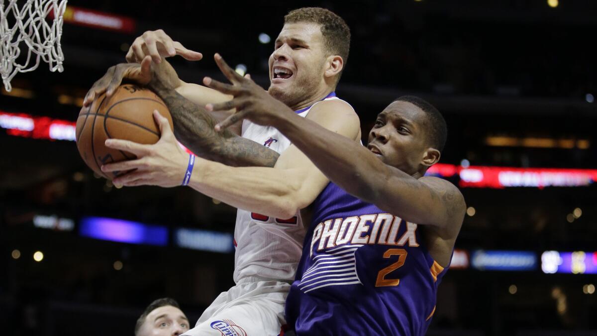 Clippers center Blake Griffin, left, is fouled by former teammate and Suns point guard Eric Bledsoe during a game last season.