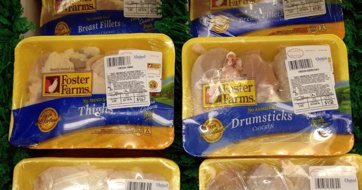 Packages of Foster Farms chicken are for sale in a cooler at a grocery store.
