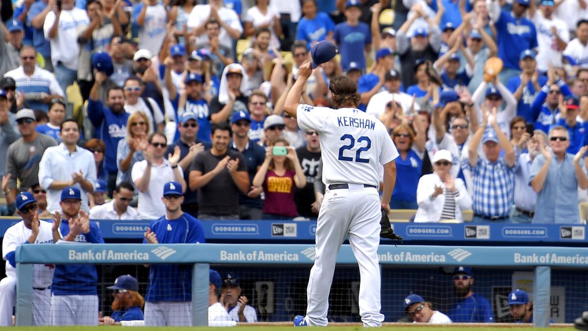 Dodgers starter Clayton Kershaw tips his cap to the fans after being taken out in the fourth inning of Sunday's game against the Padres.
