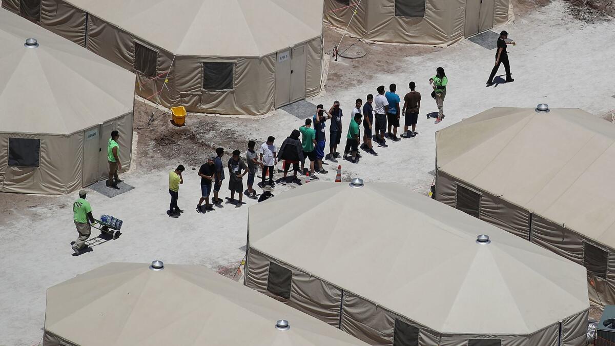 Children and workers at a tent encampment built near the Tornillo Port of Entry in Tornillo, Texas.