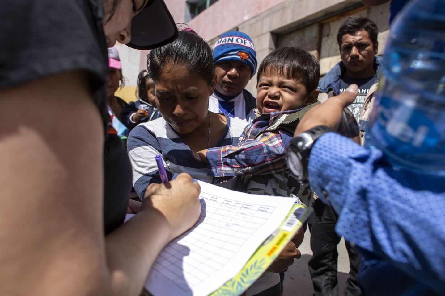 Immigrants fleeing Central American register for legal counseling in Tijuana. Lawyers have volunteered to help people seeking asylum.