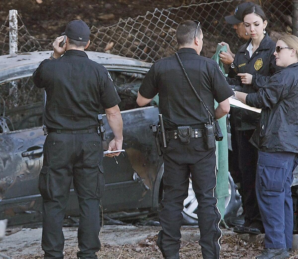 Burbank police investigate the scene of a single-vehicle multiple fatality accident on the southbound 5 freeway at the Scott Road off ramp. The incident was reported early Saturday morning.
