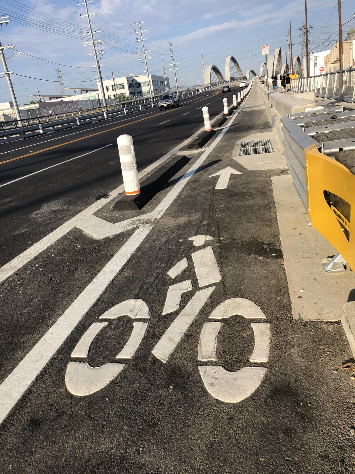 A view of a bike lane symbol on the tarmac of the 6th Street Bridge