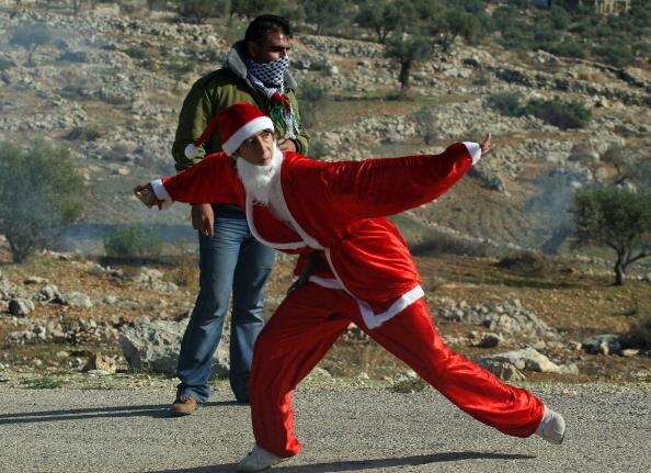 Palestinian demonstrator as Santa