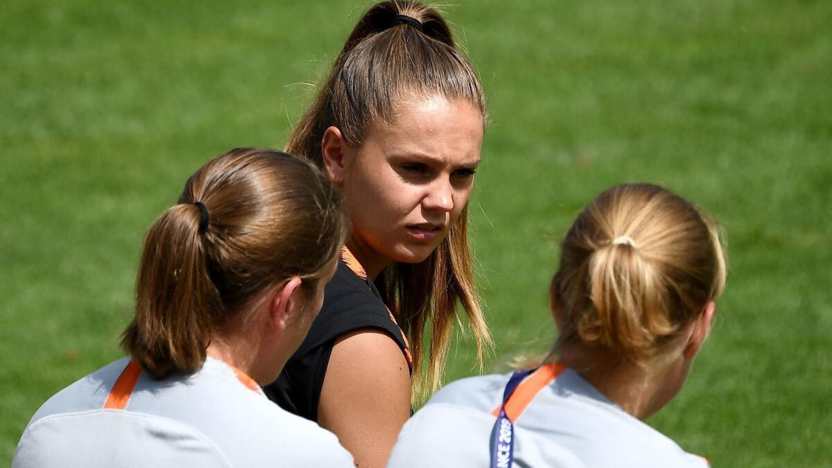 Netherlands forward Lieke Martens speaks with teammates during a training session July 2 outside Lyon, France.