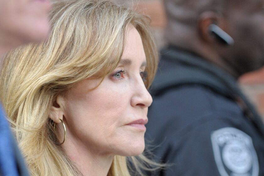 TOPSHOT - Actress Felicity Huffman exits the courthouse after facing charges for allegedly conspiring to commit mail fraud and other charges in the college admissions scandal at the John Joseph Moakley United States Courthouse in Boston on April 3, 2019. (Photo by Joseph Prezioso / AFP)JOSEPH PREZIOSO/AFP/Getty Images ** OUTS - ELSENT, FPG, CM - OUTS * NM, PH, VA if sourced by CT, LA or MoD **