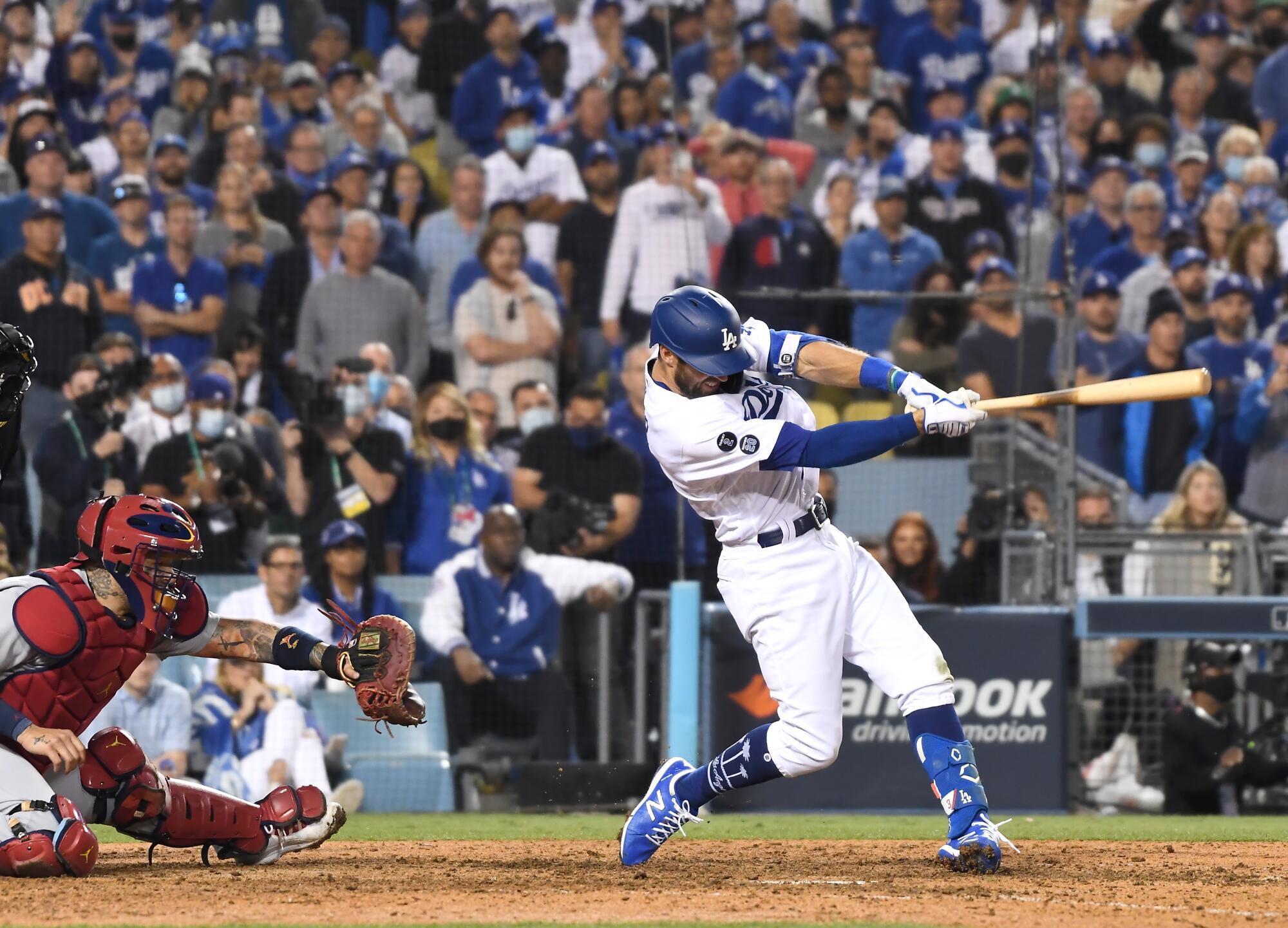 Chris Taylor hits the game-winning two-run home run during the ninth inning against the St. Louis Cardinals.