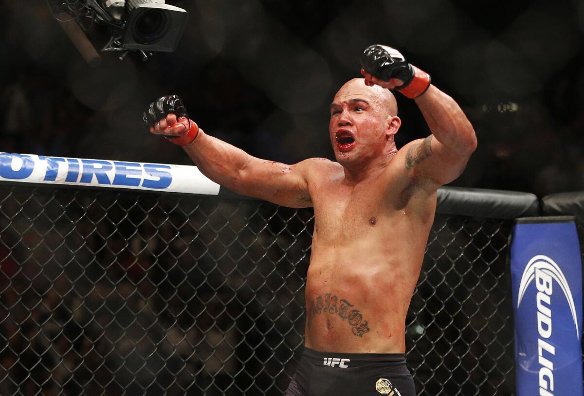 Robbie Lawler celebrates after winning the welterweight title by way of technical knockout against Rory MacDonald at UFC 189 in Las Vegas on July 11.