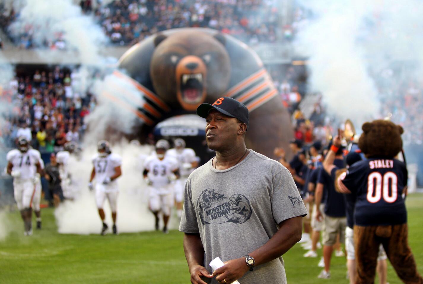 Lovie Smith walks on the field as the team is announced during the Family Night practice at Soldier Field on Aug. 6, 2010.