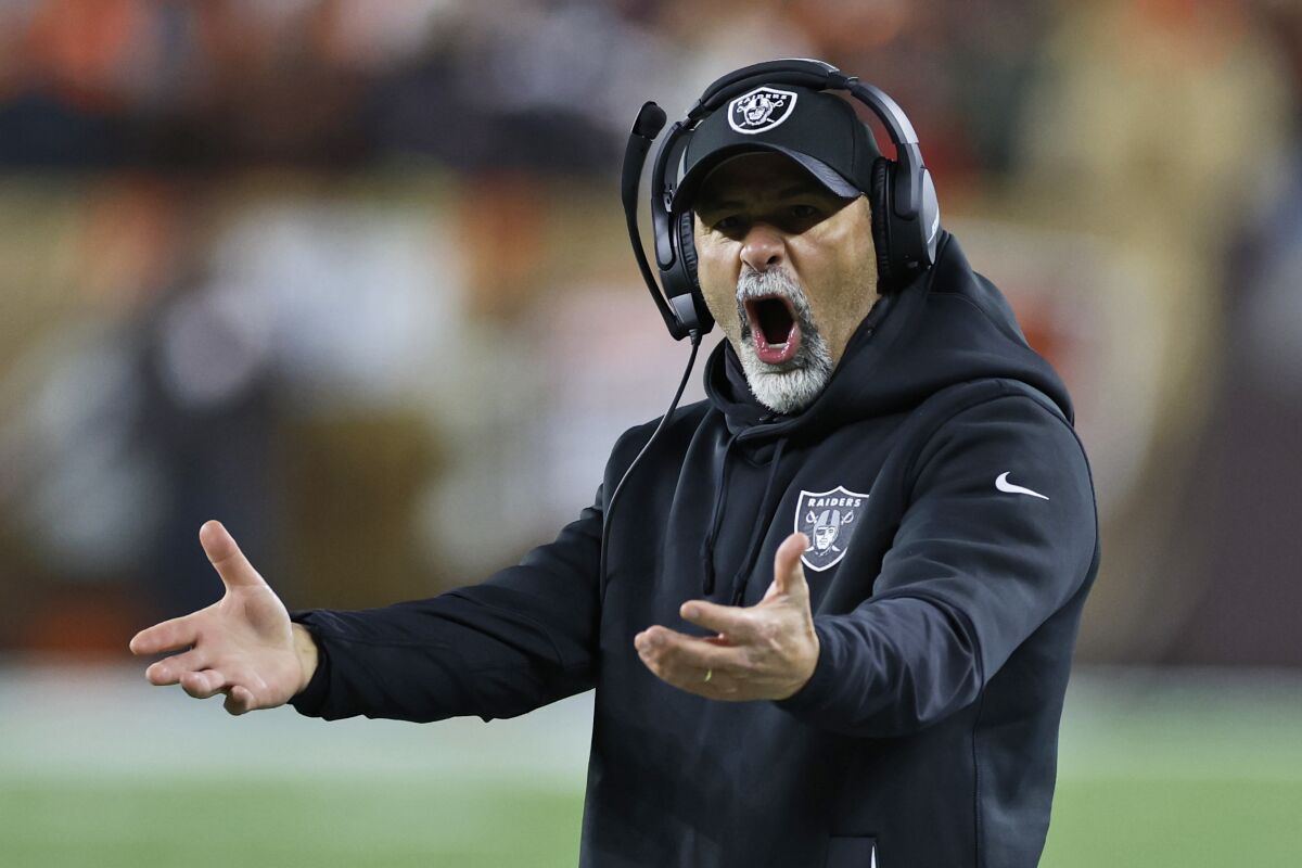 Las Vegas Raiders interim head coach Rich Bisaccia reacts during the second half of an NFL football game against the Cleveland Browns, Monday, Dec. 20, 2021, in Cleveland. (AP Photo/Ron Schwane)