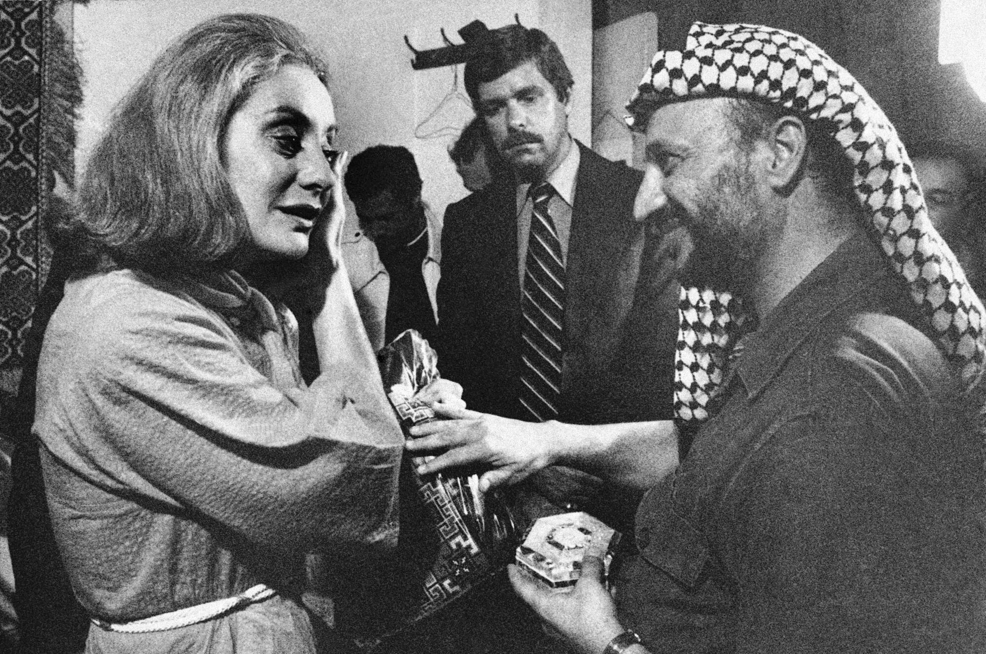 Walters with Palestinian leader Yasser Arafat in 1977 file