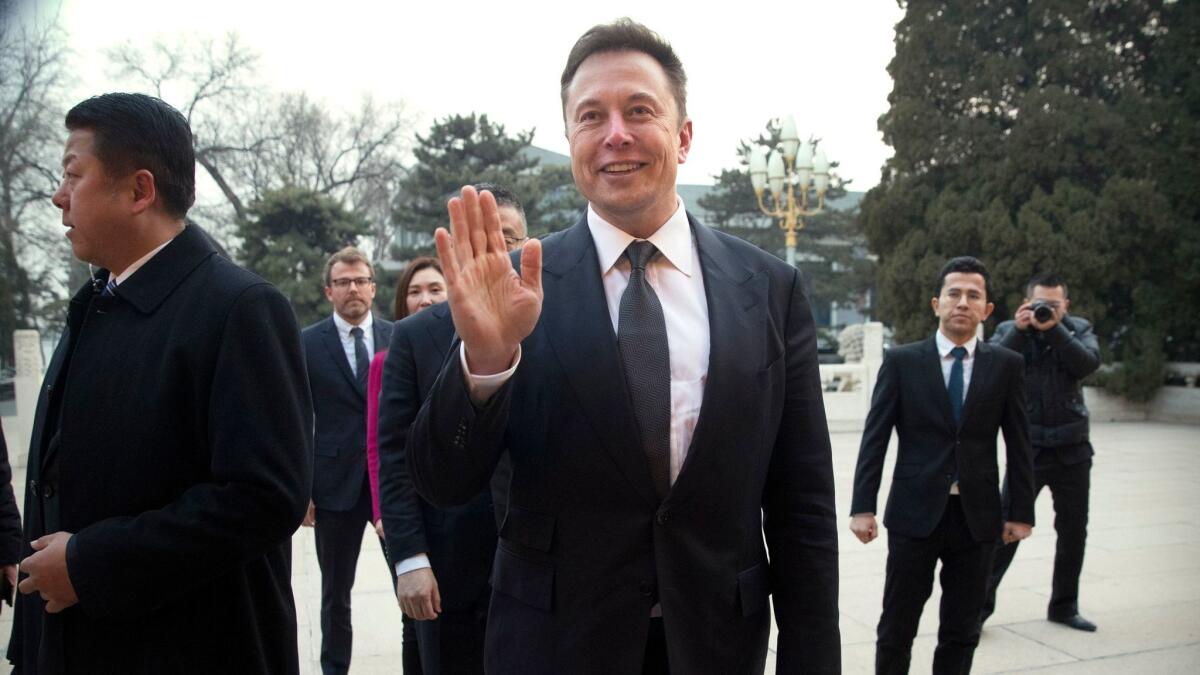 Elon Musk arrives for a meeting with Chinese Premier Li Keqiang in Beijing on Jan. 9. Tesla has big plans to build a factory in China, but funding is not yet secured.