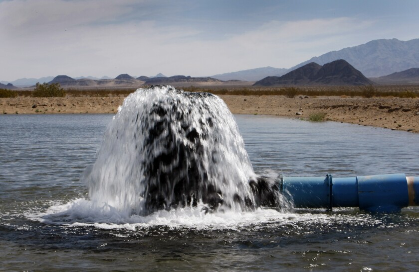 Water pours out from a pilot well on Cadiz Ranch in the Mojave Desert in 2012. 