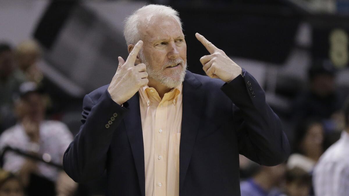 San Antonio Spurs Coach Gregg Popovich gestures from the sideline during a preseason game against the Sacramento Kings on Oct. 20.