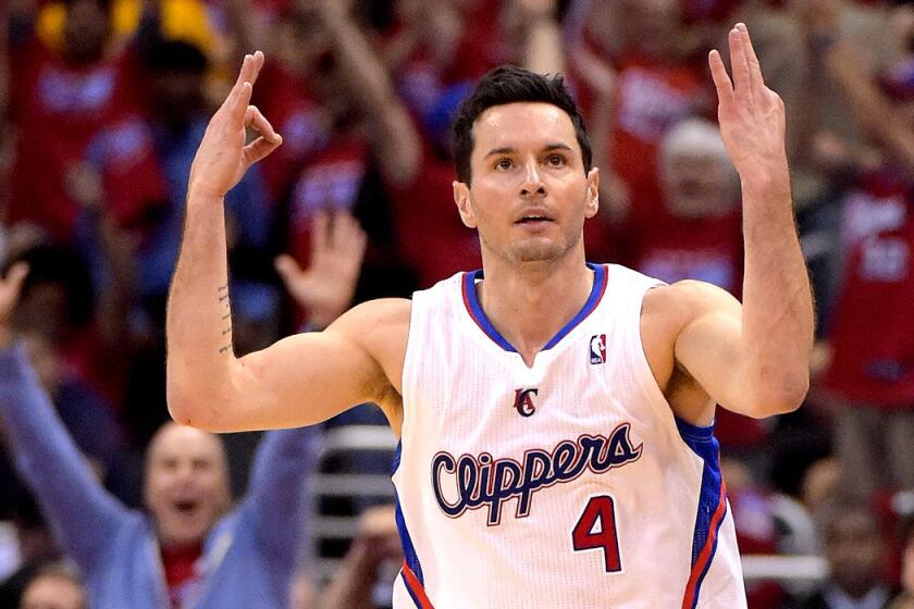 Clippers guard J.J. Redick celebrates after making a three-point shot against the Warriors in Game 7 on Saturday night at Staples Center.