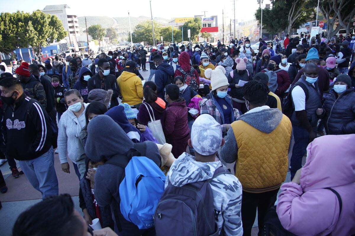 Hundreds of asylum seekers gather at El Chaparral border crossing in Tijuana in February 2021.