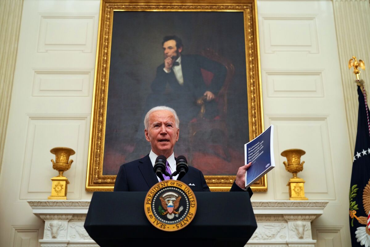 President Biden talks Thursday at the White House about his plan for addressing COVID-19.