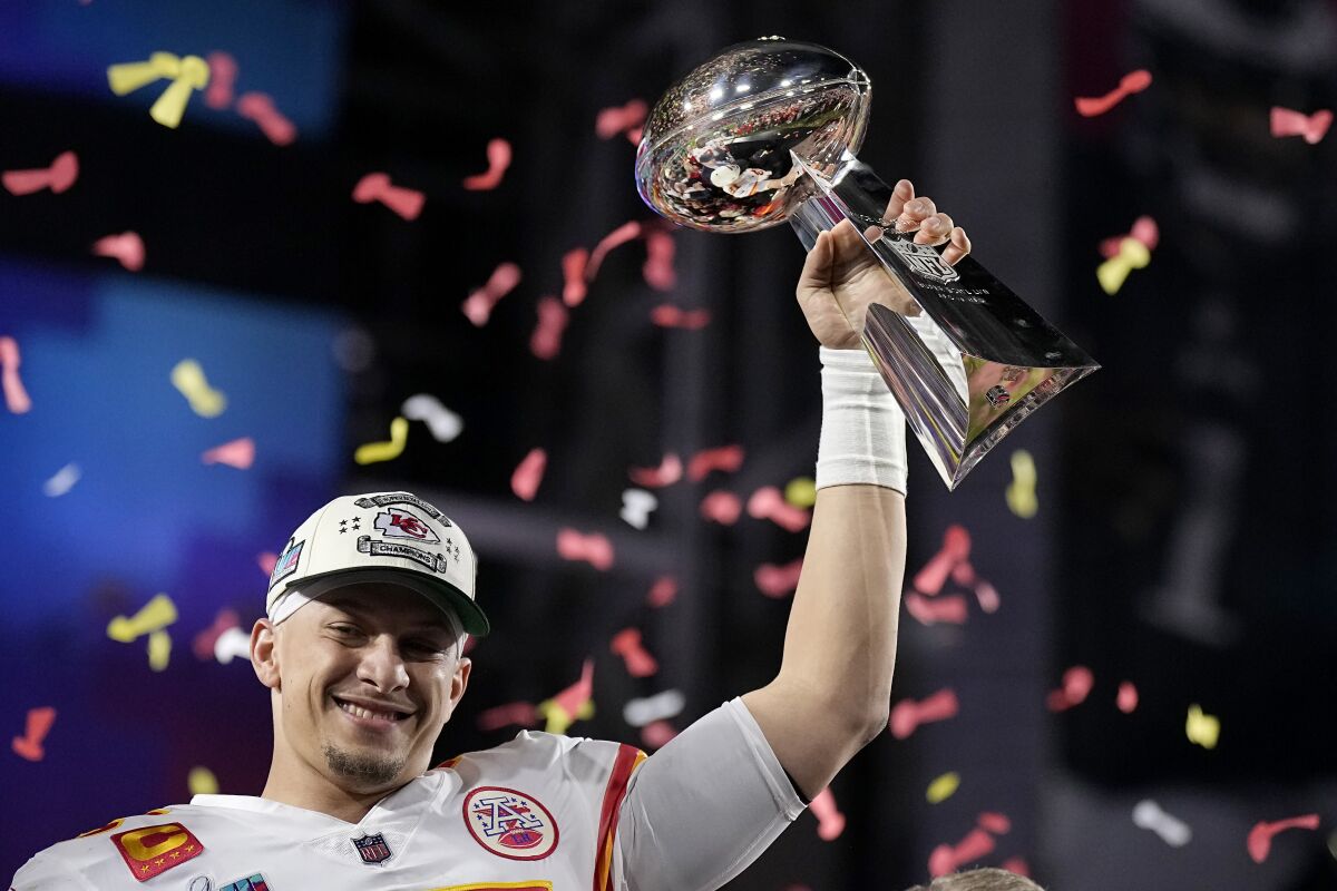 Kansas City Chiefs quarterback Patrick Mahomes lifts the Vince Lombardi Trophy after defeating the Philadelphia Eagles.