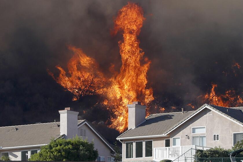 WEST HILLS, CALIF. .. - NOV. 9, 2018. The Woolsey fire burns near homes in West Hills on Friday, Nov. 9, 2018. (Luis Sinco/Los Angeles Times)