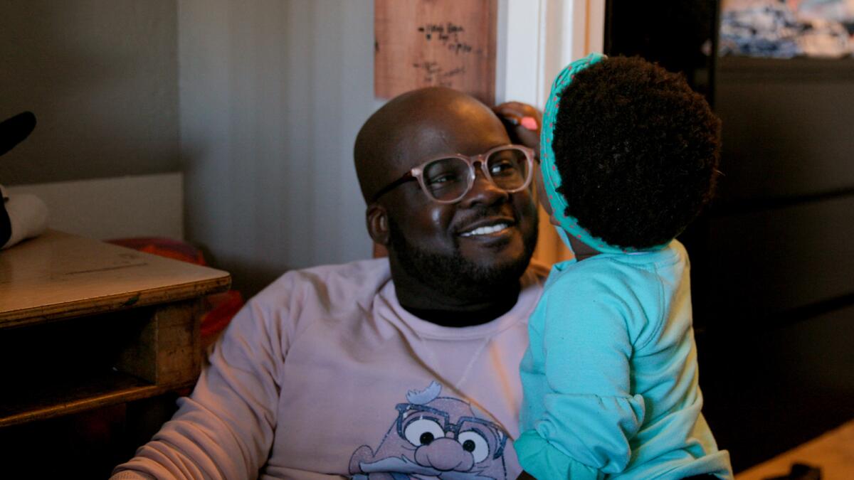 Glen Henry and his daughter in the documentary “Dads.”