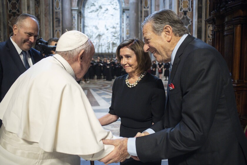 Pope Francis greeting Speaker of the House Nancy Pelosi and her husband