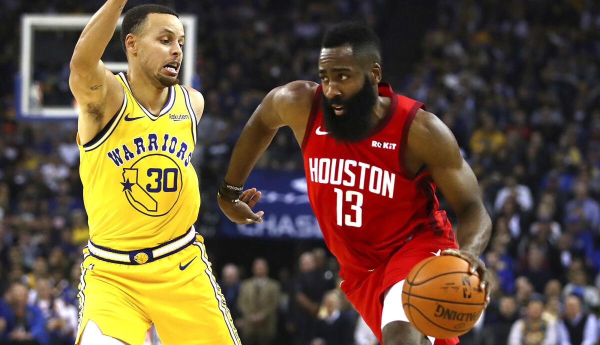 Rockets guard James Harden tries to drive past Warriors guard Stephen Curry  during a game in 2019.