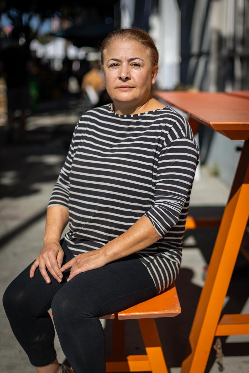     Nesrin Al-Diab, owner of Mediterranean Pastry Den, poses for a portrait  