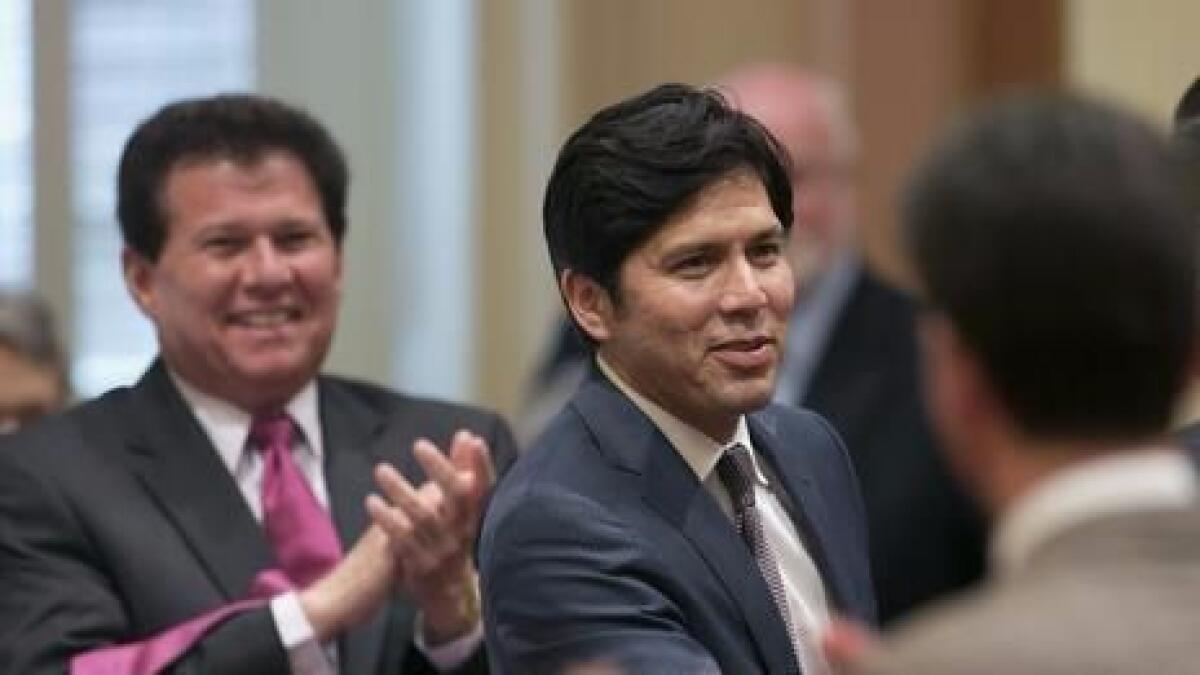 Senator Kevin de Leon,D-Los Angeles, second from left, receives congratulations from other lawmakers after he was elected as the new Senate President Pro Tem at the Capitol in Sacramento, Calif., Monday, June 16, 2014.