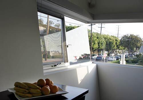 A narrow window wraps around a corner in Judy Premingers duplex. (Christine Cotter./.LAT)