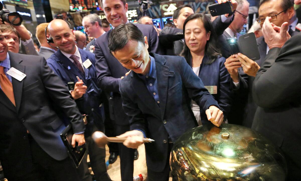 Jack Ma, the founder of China-based Alibaba, rings a ceremonial bell on the floor of the New York Stock Exchange during the e-commerce company's initial public offering in September 2014. The 68 IPOs in last year's third quarter, led by the record $25-billion debut of Alibaba, generated $38 billion in cash for companies. This year's third quarter brought in $7.3 billion.