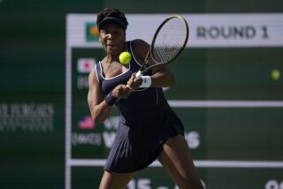 Venus Williams, of the United States, returns to Nao Hibino, of Japan, at the BNP Paribas Open.