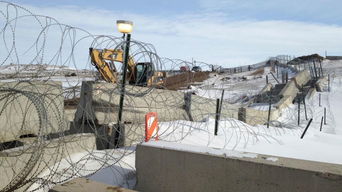 Razor wire and concrete barriers protect the Dakota Access pipeline drilling site near Cannon Ball, N.D.