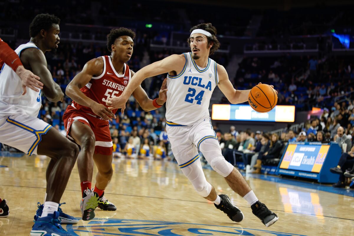 Bruins forward Jaime Jaquez Jr. drives toward the lane against Cardinal forward Harrison Ingram.