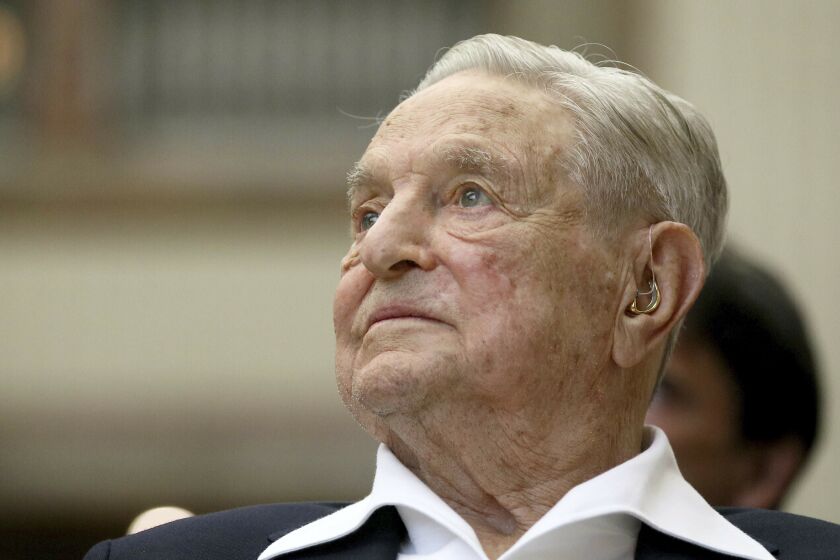 FILE - George Soros, founder and chairman of the Open Society Foundations, attends the Joseph A. Schumpeter Award ceremony in Vienna, Austria, June 21, 2019. As former President Donald Trump braces for a potential indictment related to hush money payments made on his behalf during his 2016 campaign, Republicans blasting the case as politically motivated are blaming a frequent target: Soros. (AP Photo/Ronald Zak, File)